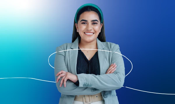 A lady in an office attire smiling with a blue gradient background.