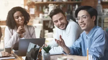 Diverse group having a meeting in a cozy office setting.