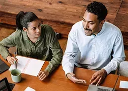 2 people working together