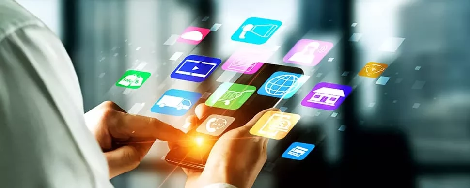 Person using a smartphone with app icons floating around.