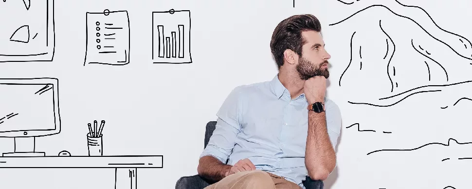 Man sitting in chair, thinking, with doodle background of charts and mountains.