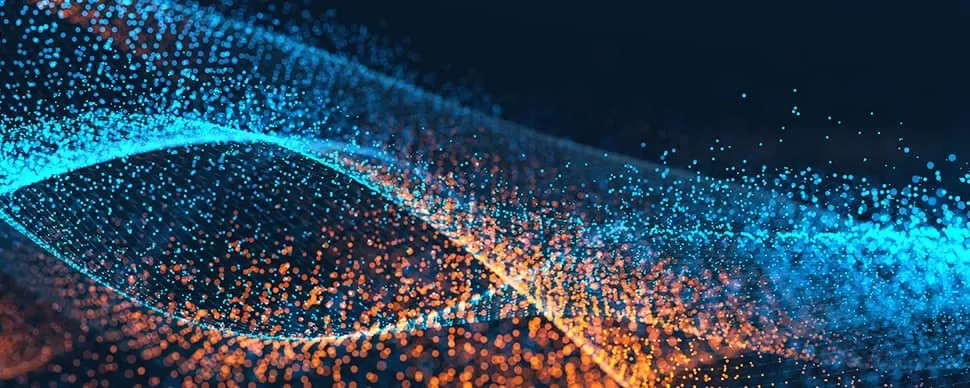 Abstract image of blue and orange particle waves on a dark background.