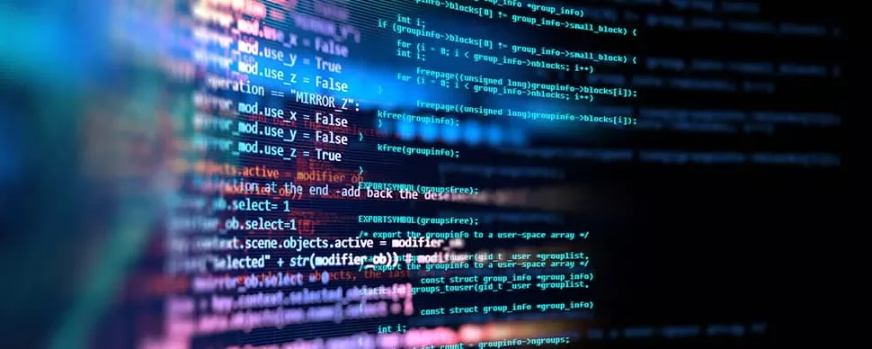 Close-up of colorful code on a computer screen displaying programming language syntax.