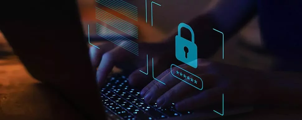 Hands typing on keyboard with digital security lock icon overlay.