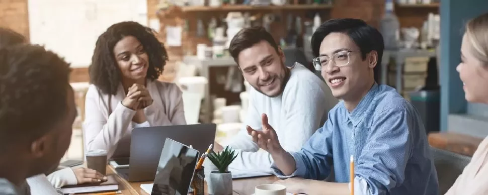 Diverse group having a meeting in a cozy office setting.